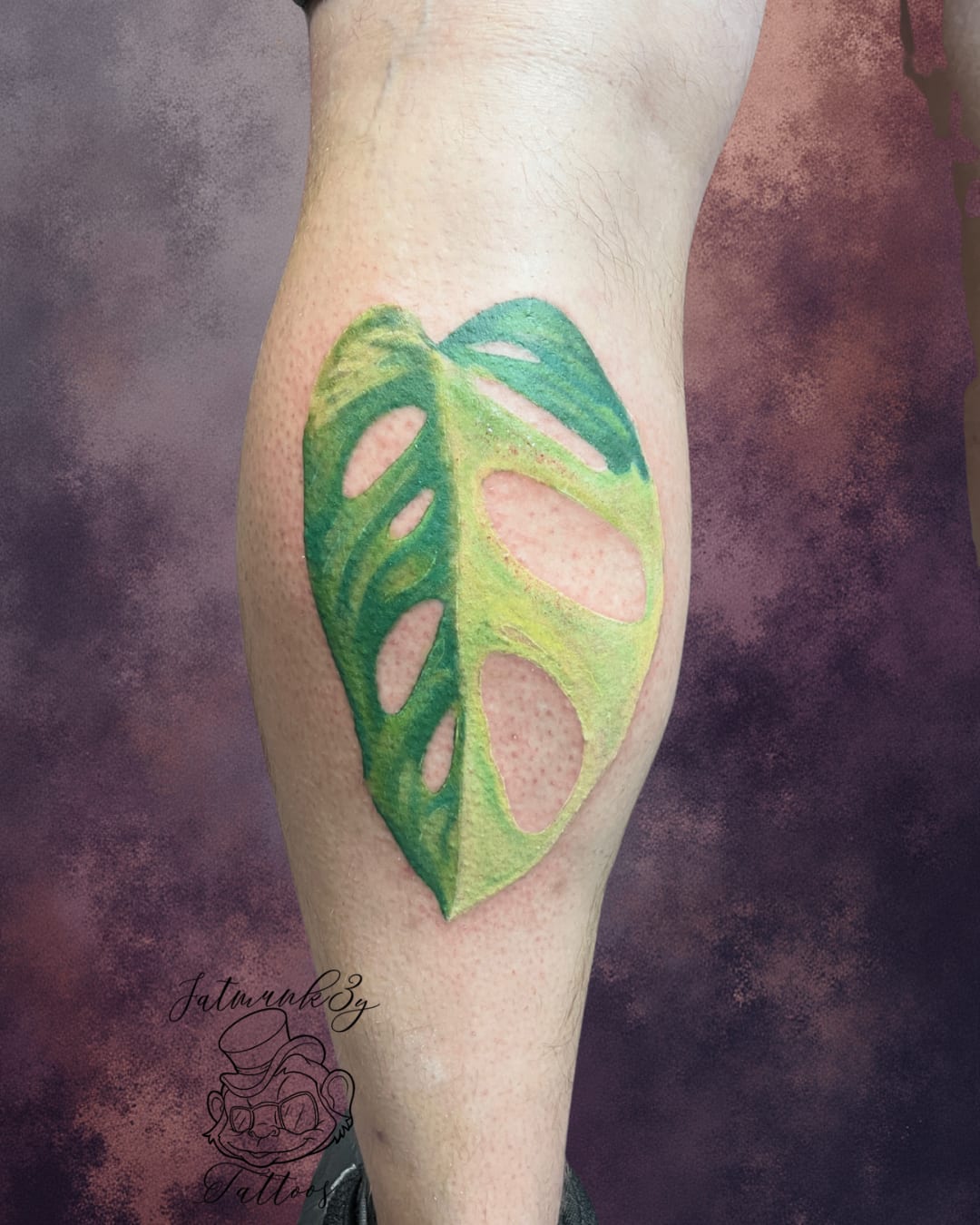 Custom color monstera leaf plant tattoo on leg by Spencer Holmes, Fatmunk3y Tattoos Columbus Ohio