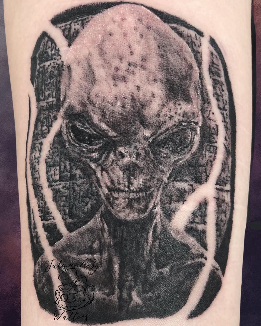 Custom black and grey realism alien tattoo on arm by Spencer Holmes, Fatmunk3y Tattoos Columbus Ohio