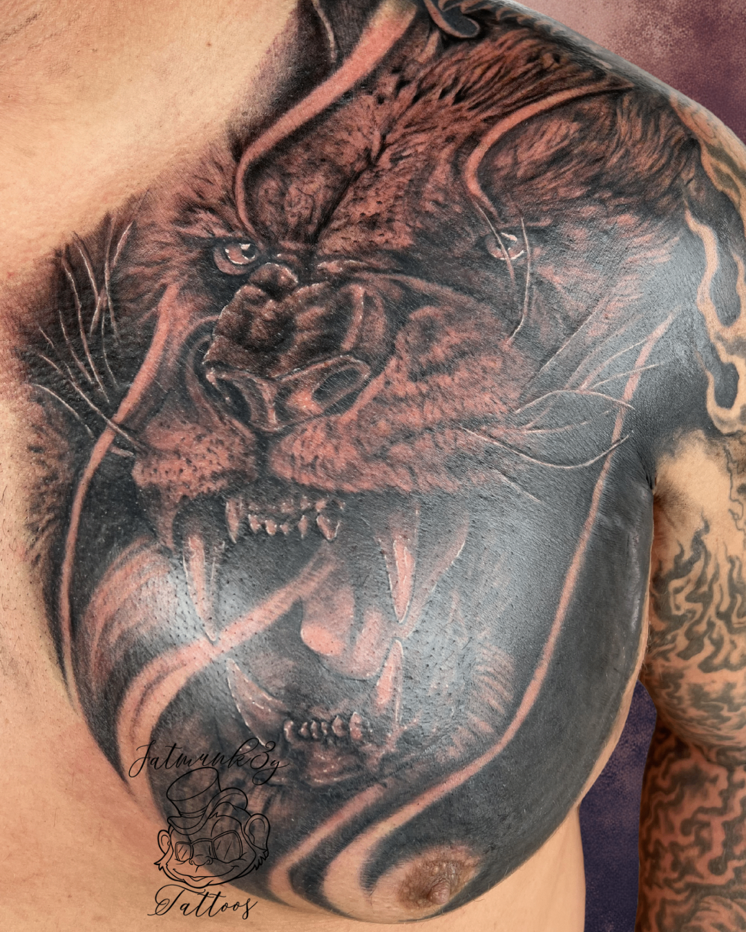 Custom black and grey realism lion chest tattoo by Spencer Holmes, Fatmunk3y Tattoos Columbus Ohio