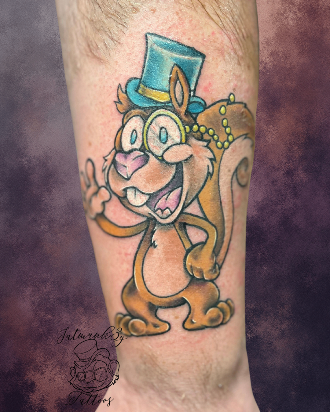 Custom color whimsical cartoon squirrel tattoo on arm by Spencer Holmes, Fatmunk3y Tattoos Columbus Ohio
